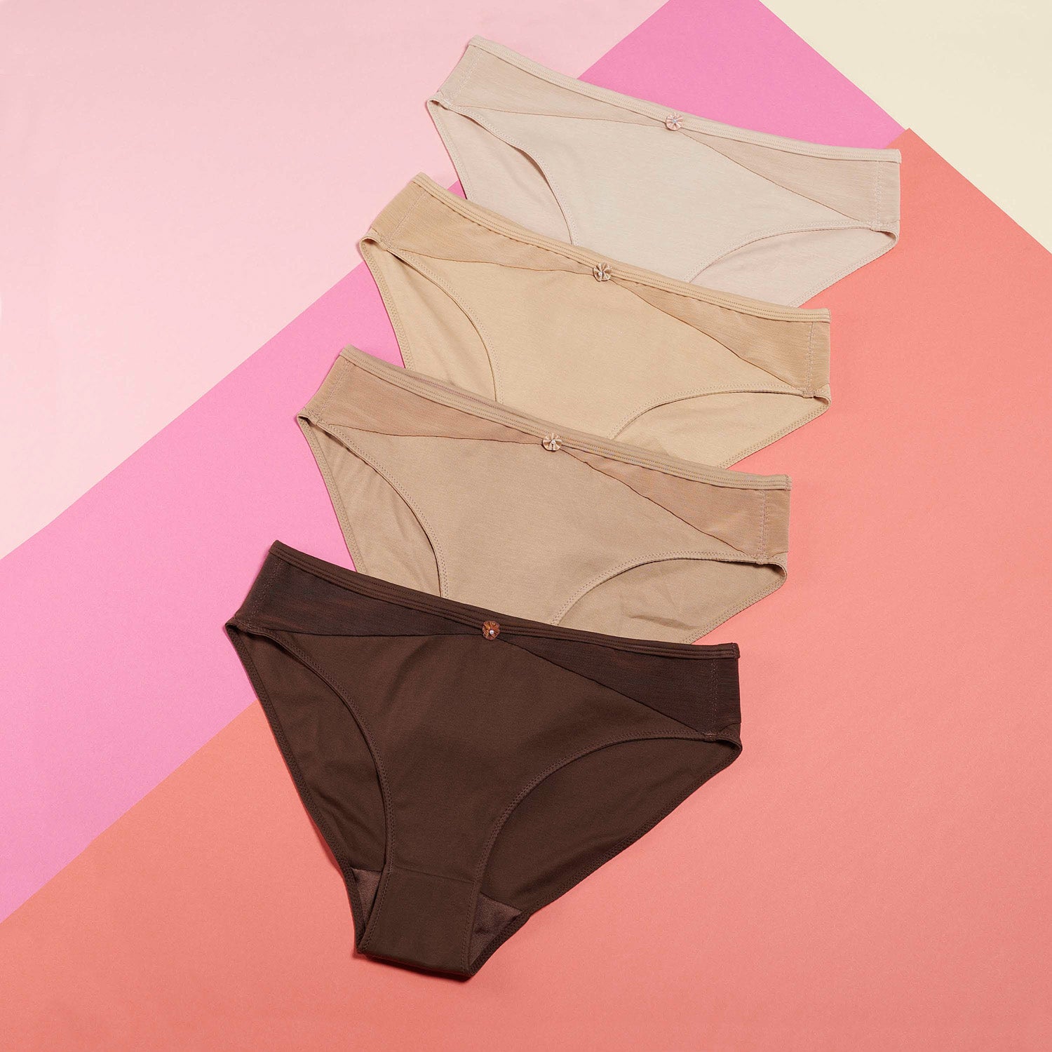 Flat lay of organic cotton briefs in nude and dark shades – JulieMay Lingerie