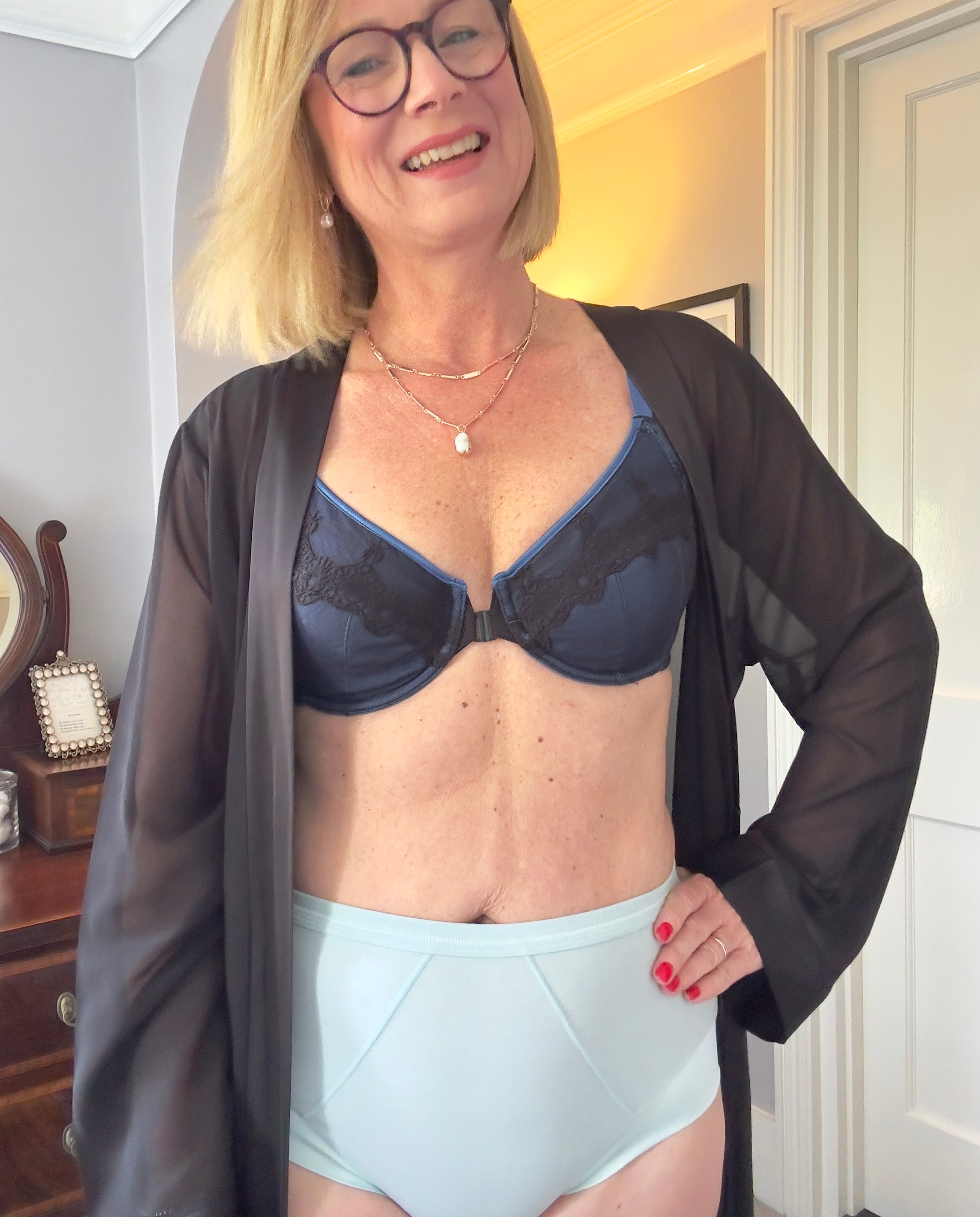 Customer in a navy JulieMay bra, blue high-waist briefs and a sheer robe