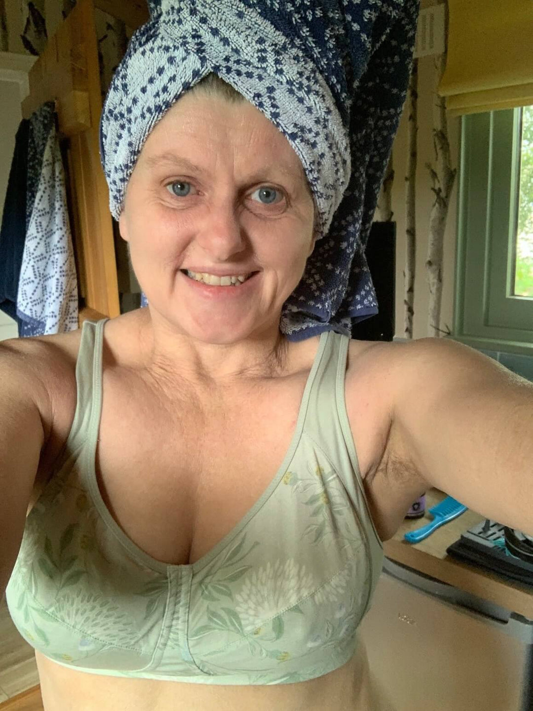 Customer wearing a sage green organic cotton bralette